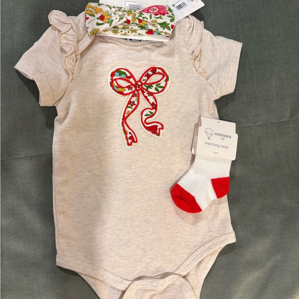 Charming Cream Bodysuit with Red Bow by [Brand]